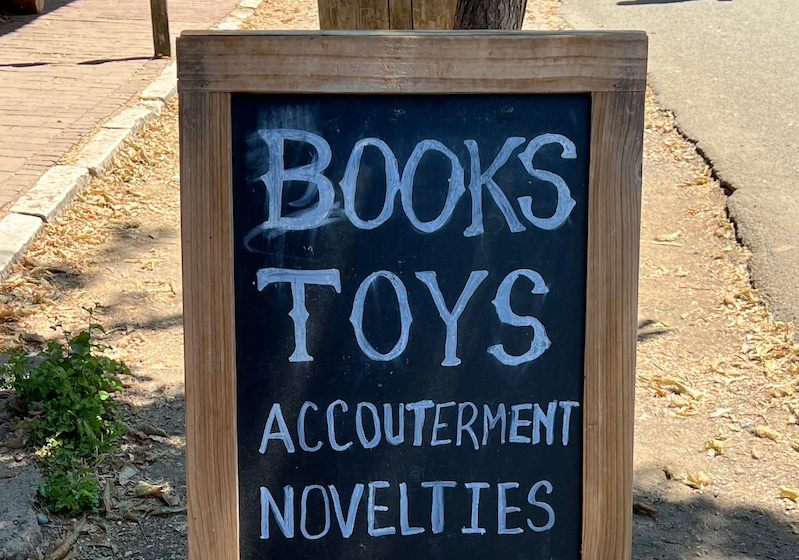 Handmade sign reading books, toys, accouterment, novelties.