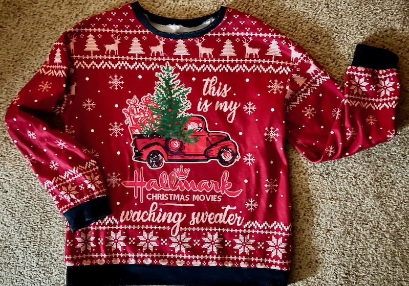 Christmas sweater with a misspelled message: This is my Hallmark Christmas Movies waching sweater.